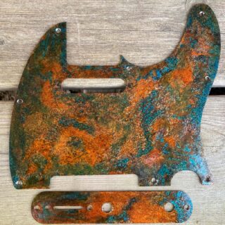relic tele pickguard with blue and rusted orange hues